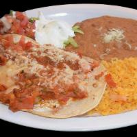 Huevos Rancheros / Ranch Style Eggs · With rice, beans and salad.