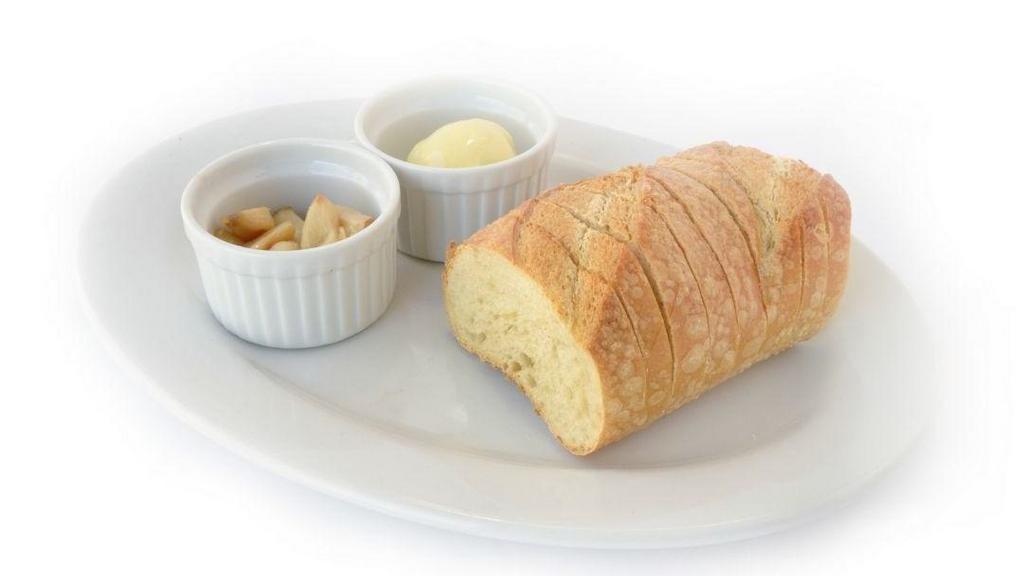 Sourdough & Roasted Garlic · Warm sourdough, a blend of butter & extra virgin olive oil, whole roasted garlic cloves on the side