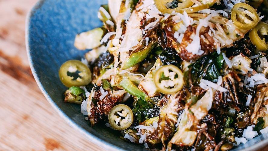 Roasted Brussels Sprouts · Macadamia nuts, toasted coconut, coconut-maple vinaigrette. (gluten free, vegan)