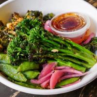 Luau Bowl · brown rice, snap peas, brussel sprouts, broccolini, pickled red onions, nuts 'n' seeds, swee...