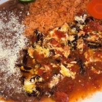Aporreadillo · Dry fried jerky with eggs in red sauce.