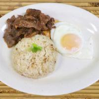 Tapsilog · Saucy Beef Tapa, garlic fried rice and fried egg.