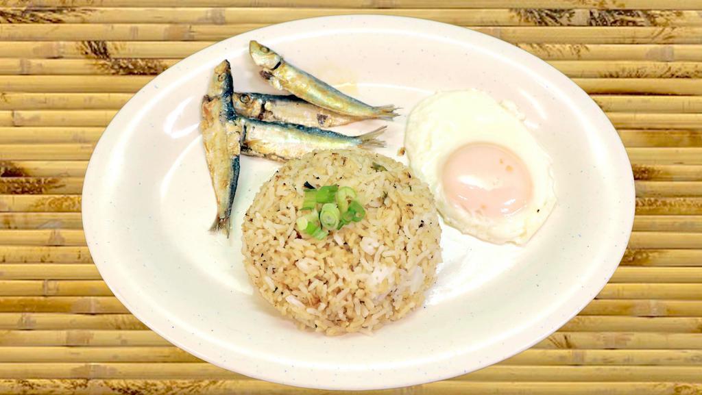 Tuyosilog · Dried salted herring, garlic fried rice and fried egg. Spiced vinegar is perfect condiment for this breakfast.