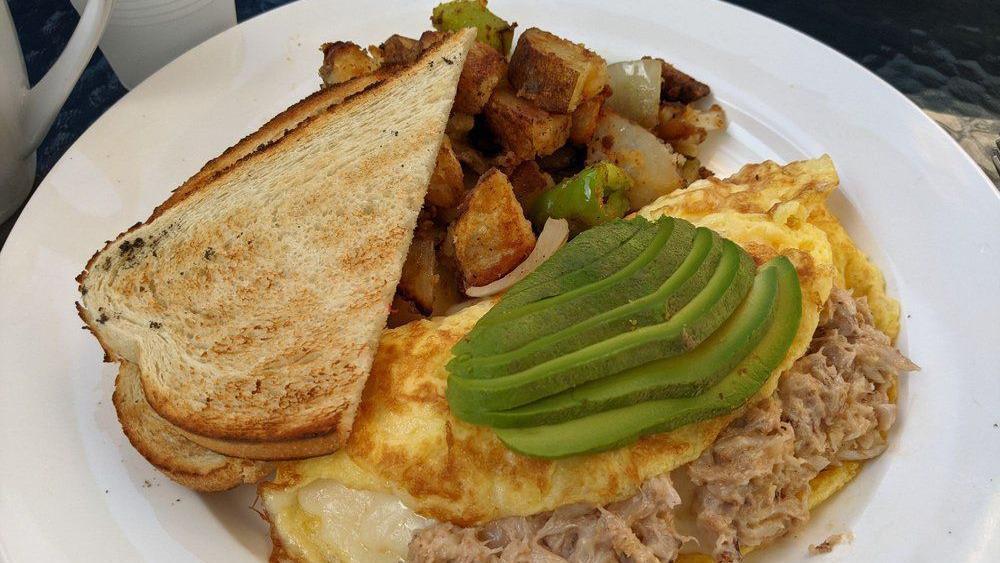 Goat Omelette · Goat cheese, ham, mushroom, onions, breakfast potatoes and toast.