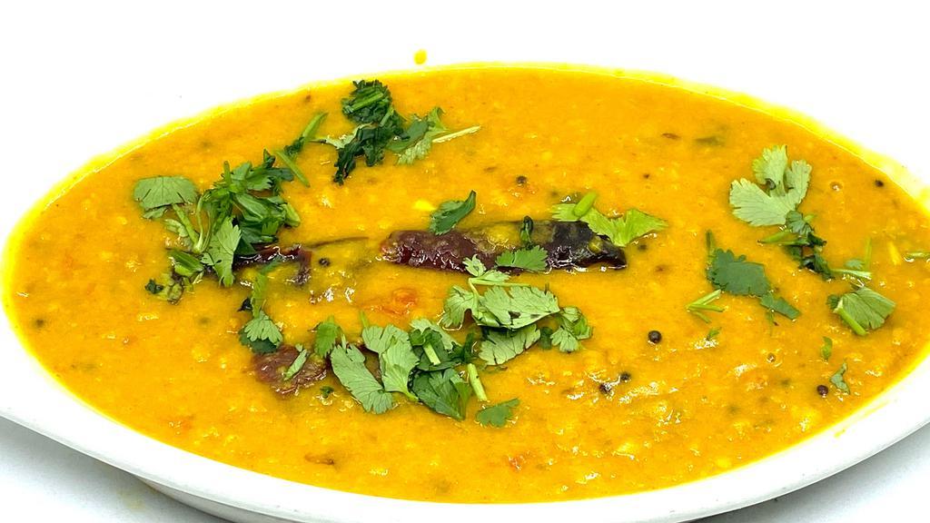 Dal Makhni · Dal makhani is a popular Indian dish made by simmering whole black lentils & red kidney beans with spices, butter & cream
