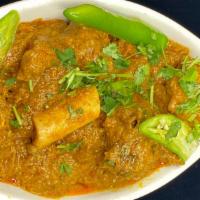 Goat curry · A classic North and South Indian dish baby goat in a cardamom sauce.