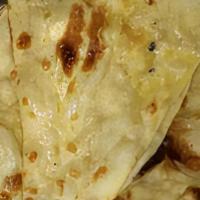 Butter Naan · Naan is a leavened flatbread made from white flour. Typically, yeast and yogurt are used to ...