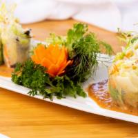 Fresh Salad Rolls · Contains nuts. Prawns, bean sprouts, lettuce and cilantro wrapped in fresh rice paper served...