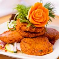 Fish Cake · Deep fried fish meat mixed with green beans and curry paste served with cucumber salad. Cont...