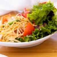 Som Tum Salad (Papaya Salad) · Spicy, healthy, contains nuts. Shredded green papaya seasoned with lime dressing, chili, tom...