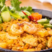 Pineapple Fried Rice · Contains nuts. Fried rice with egg, pineapple, shrimp, chicken, onions, cashew nuts, green p...