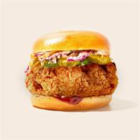 BBQ Fried Chicken Sandwich · Fried chicken with coleslaw and bbq sauce on a fluffy bun.