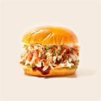 Bbq Chicken Sandwich · Smoked pulled chicken with bbq sauce on a fluffy bun and coleslaw on the side