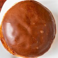 Custard Filled Donut · Random icing donut with yummy custard filling! Depending on availibity!
