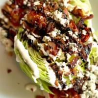 Wedge Salad
 · Baby iceberg, tomato, bacon, blue cheese crumble dressing, balsamic reduction. Add chicken b...