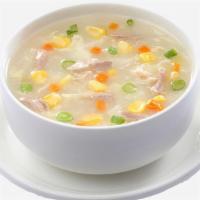 Chicken Corn Soup · A thick soup of corn kernels and shredded chicken.