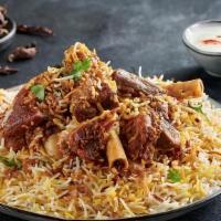 Goat Dum Biryani · A mixture of aromatic Basmati rice, Indian herbs, succulent pieces of goat meat cooked in th...