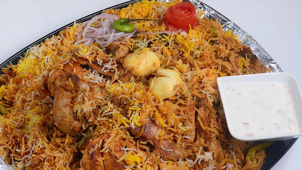 Hyderabad Chicken Dum Biryani · A mixture of aromatic basmati rice, Indian herbs, tender pieces of chicken and our famous Hyderabadi biryani masala cooked in the traditional Hyderabadi dum style.