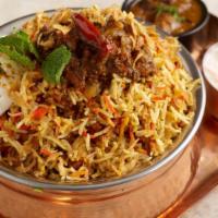Gongura Chicken Biryani · Aromatic Basmati rice made with Indian herbs served over succulent pieces of chicken cooked ...