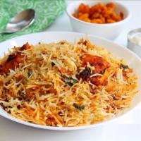 Fish Biryani · Aromatic Basmati rice made with Indian herbs served over fried fish pieces and house made sp...
