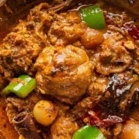 Kadai Chicken · Chicken cooked in onion sauce made with special Indian spices, onions and bell peppers.