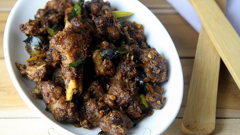 Mutton Sukka · Bone-In Mutton cooked with dry spice on a hot grill.