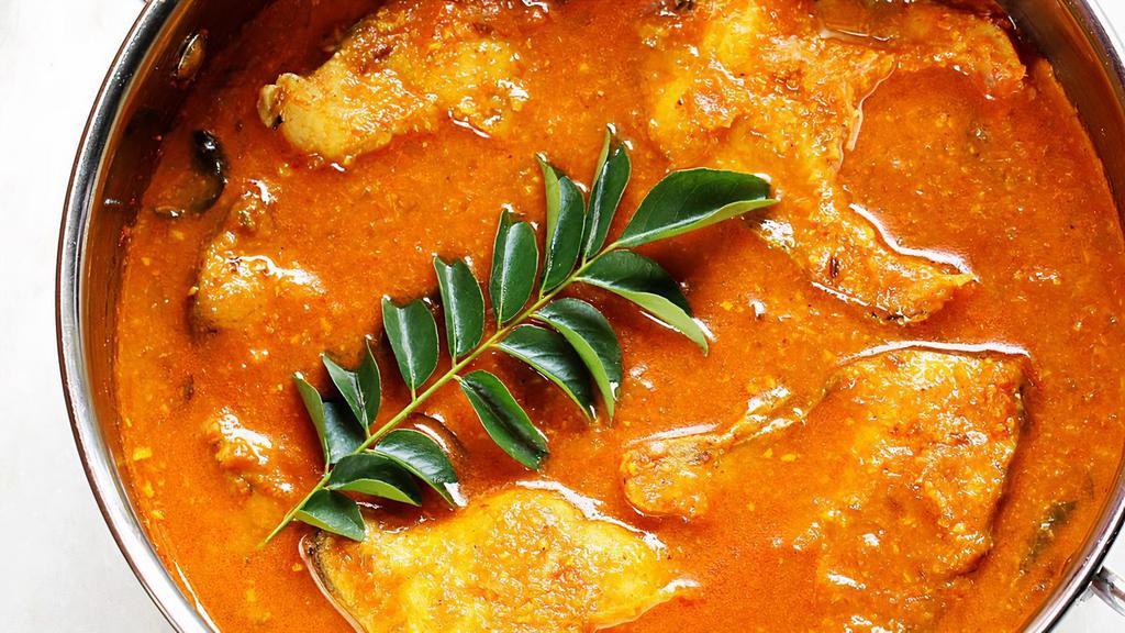 Fish Curry · Fish Cooked in house special masala sauce.