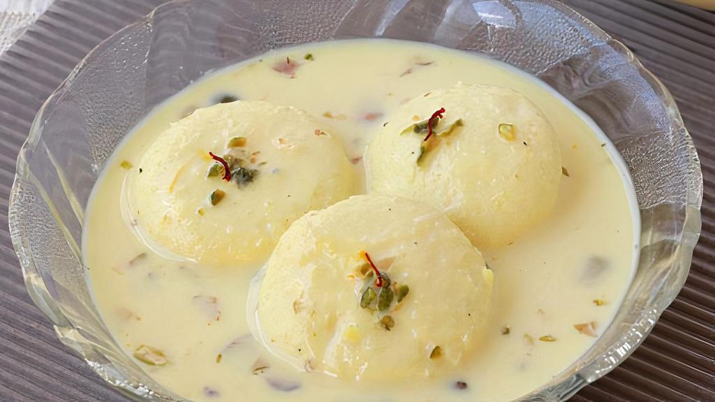 Ras Malai (3 Pcs) · Indian condensed cheese with flavored milk.