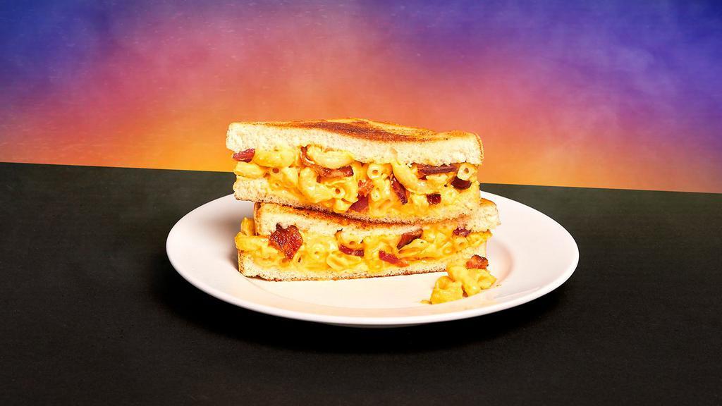 Bacon Mac and Cheese Melt Sandwich · Mac and cheese with crispy bacon sandwiched between two slices of toasted white bread.