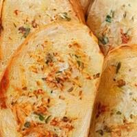 Garlic Bread · Fresh bread covered in garlic butter.