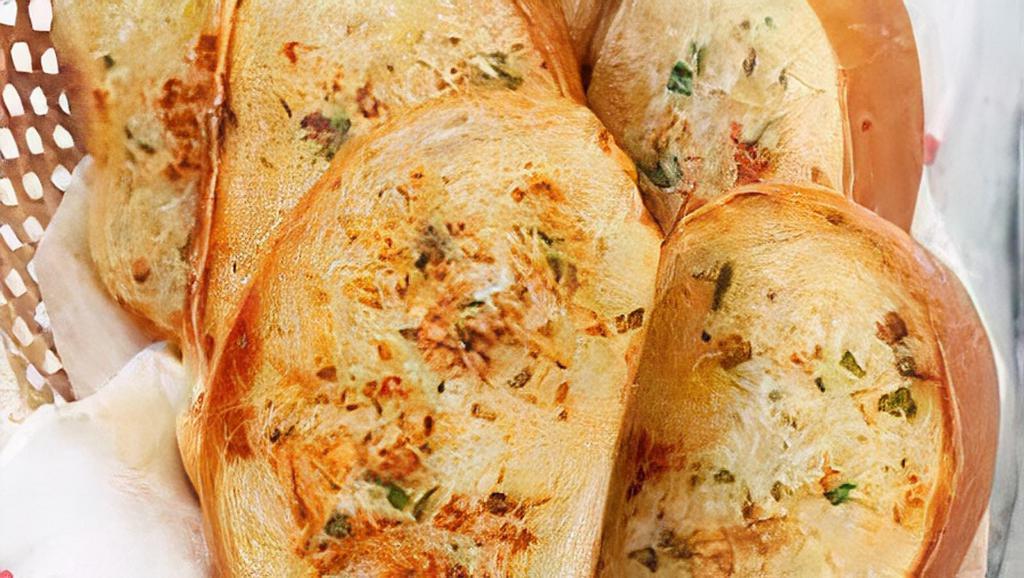 Garlic Bread · Fresh bread covered in garlic butter.