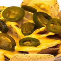 Nachos · Chips topped with nacho cheese and jalapeños.