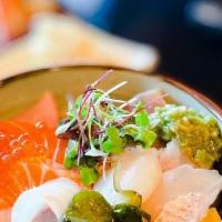 Chirashi · Chef's choice sashimi over sushi rice with Japanese pickles and tamago.