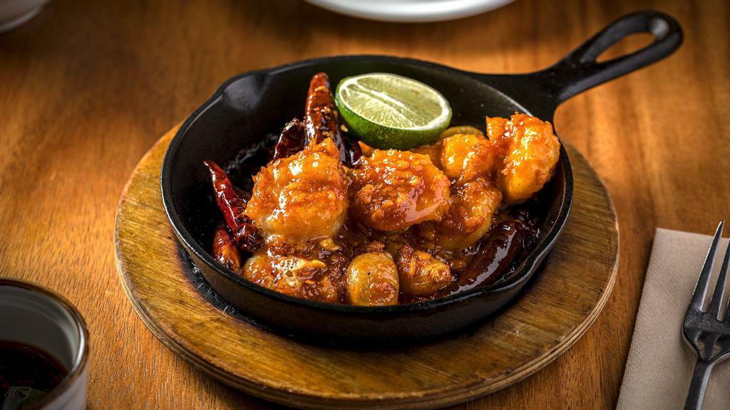 Skillet Shrimp (8 Pieces) · Gluten-Free. Garlic, ginger, chili, and shrimp served sizzling on a hot skillet.