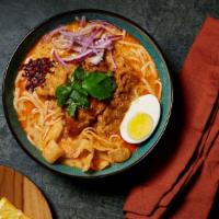 Coconut Chicken Noodle Soup (Ohn Noh Kaut Swer) · Slowly cooked together with chicken thighs, coconut milk, onion, garlic, and turmeric. The s...