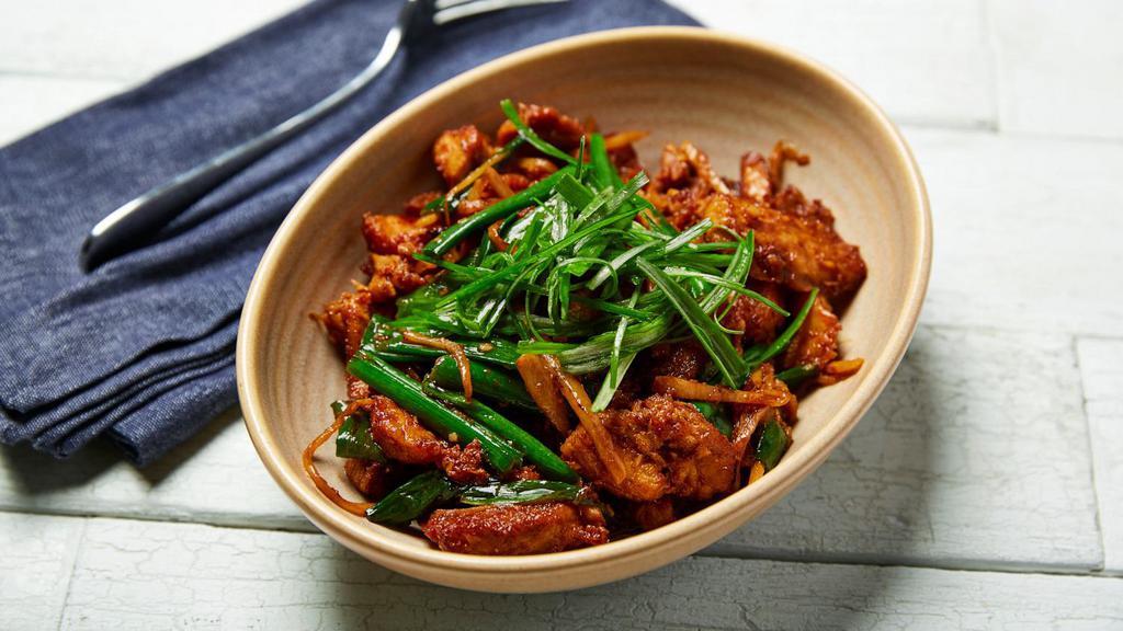 Pork Belly with Ginger & Chili · Pork Belly wok tossed with garlic, ginger, Thai chili, soy sauce, and green onions.