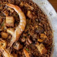 *Paella Mixta · Pork, chicken, seasonal mushrooms, gulf shrimp & octopus (gluten free)