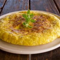 Spanish Tortilla (v) · Flavorsome authentic Spanish omelette made with eggs, potatoes & caramelized onion. A timele...