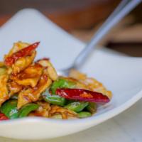 Kung Pao Chicken · Chili pods, scallions, bell peppers, roasted peanuts, firecracker sauce.