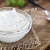 Sour Cream · Chilled sour cream on the side, served in a 2 oz container.