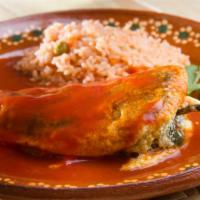 Chile Relleno · Pepper filled with melted queso, and coated in a delicate, slightly crispy coating, and serv...