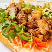 Beef Banh Mi Sandwich · Korean marinated beef, baguette, pickled carrots and daikon, cucumbers, jalapeno, mayo and c...