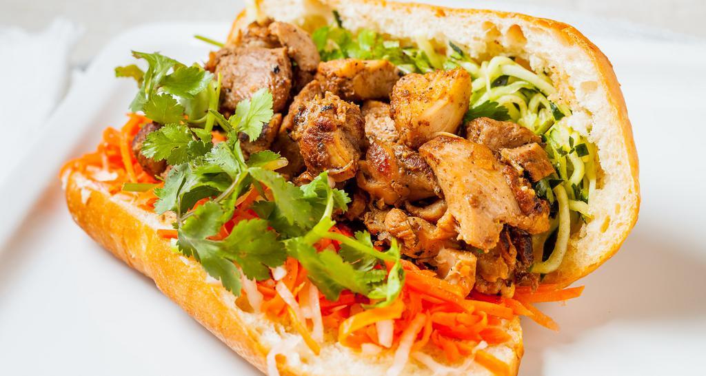 Chicken Banh Mi Sandwich · Five spice chicken, baguette, pickled carrots and daikon, cucumbers, jalapeno, mayo and cilantro