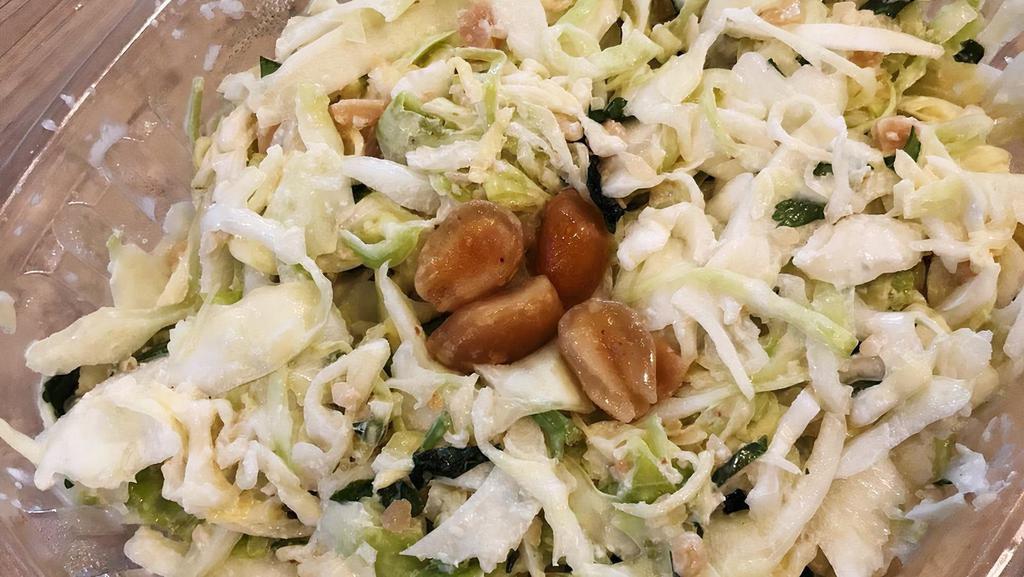 Ginger Peanut Slaw · Thinly sliced cabbage, herbs, peanuts, with ginger dressing