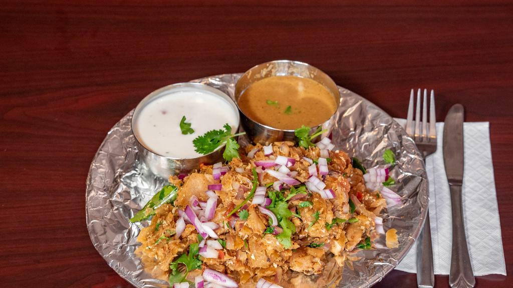 Chicken Kothu Parotta · Roasted paratha shredded into bite pieces and stir fried with chicken along with vegetables and spices.