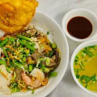 59. Mi` Đa` Lạt Đặc Biệt · Egg Noodle Soup with Jumbo Shrimp, Crab Leg & Meat
(Due to supply chain issues, we will repl...