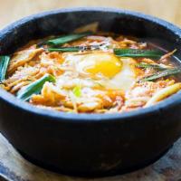 Spicy Ramen · Curly flour noodle soup with vegetables and egg. Broth is made with kelp and vegetables.
