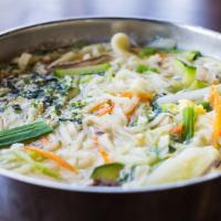 Korean Noodle Soup · Thick flour noodle soup with vegetable, scallions, and egg. Broth is made with kelp and vege...