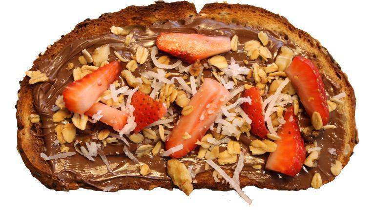 Nuts About Toast · Nutella, strawberry, walnuts, granola and coconut sheds.