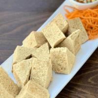 Crunchy Tofu · Fried organic tofu served with sweet sauce. Top with ground peanut.